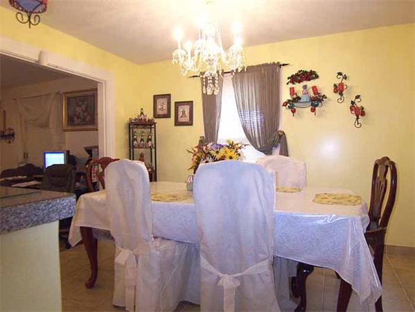 3 Norfolk Street Springfield, MA 01109 - Photo 4 of 15 a view of a livingroom with furniture and a chandelier