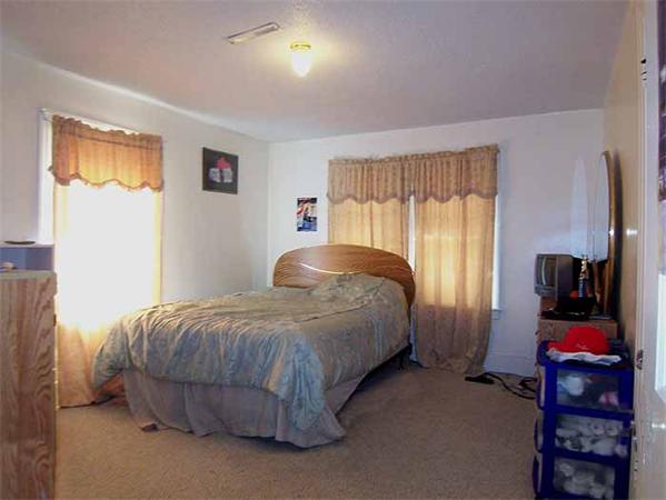 3 Norfolk Street Springfield, MA 01109 - Photo 9 of 15 a bedroom with a bed and a window