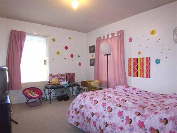 3 Norfolk Street Springfield, MA 01109 - Photo 10 of 15 a bedroom with bed and furniture