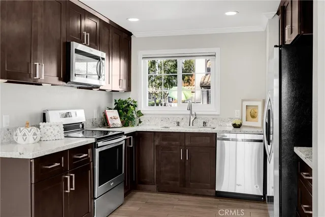 a kitchen with a sink stove and microwave