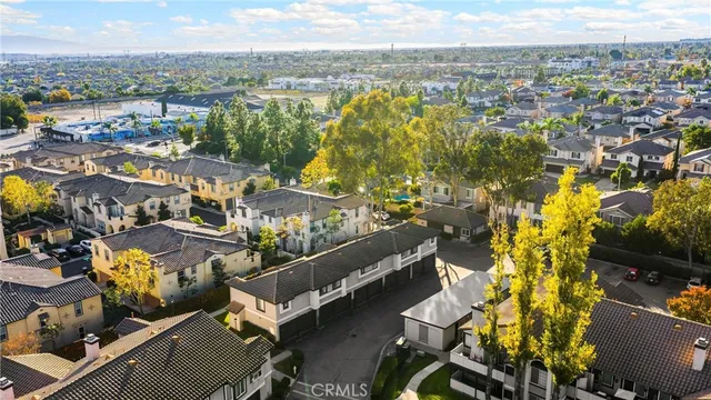 an aerial view of residential building and parking space
