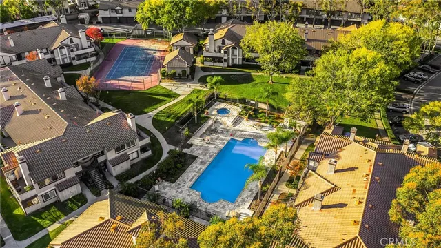 an aerial view of a house with swimming pool