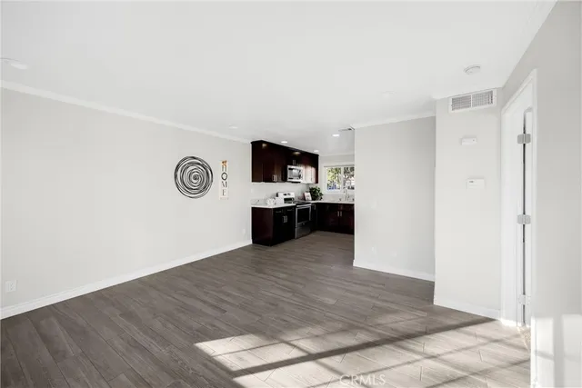 a view of kitchen with wooden floor