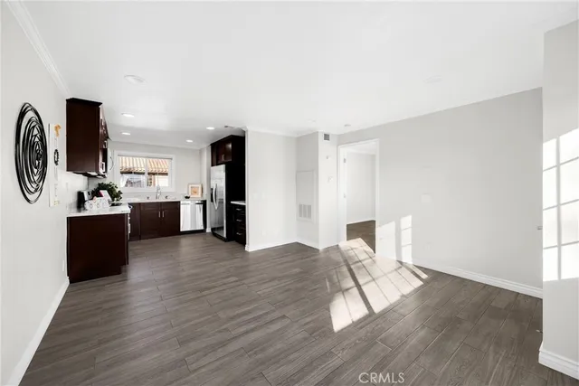 a view of kitchen with furniture and wooden floor