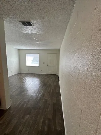 a view of outdoor space with a garden and car parked