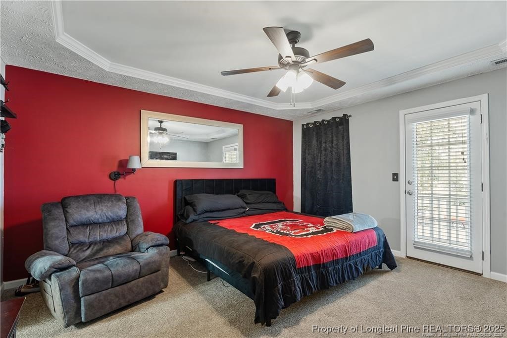 717 Lenoir Drive Spring Lake, NC 28390 - Photo 20 of 47 a bedroom with a bed couch and window