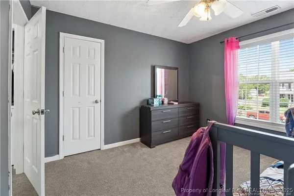 a view of a bedroom and a window