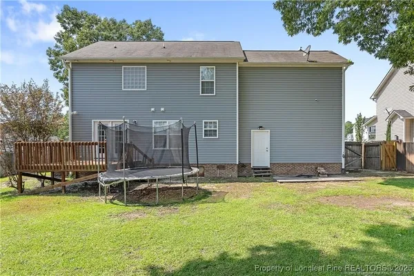 a backyard of a house with outdoor seating