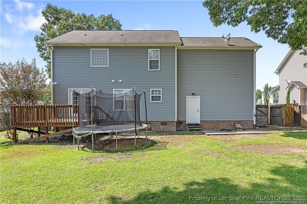 717 Lenoir Drive Spring Lake, NC 28390 - Photo 41 of 47 a backyard of a house with outdoor seating