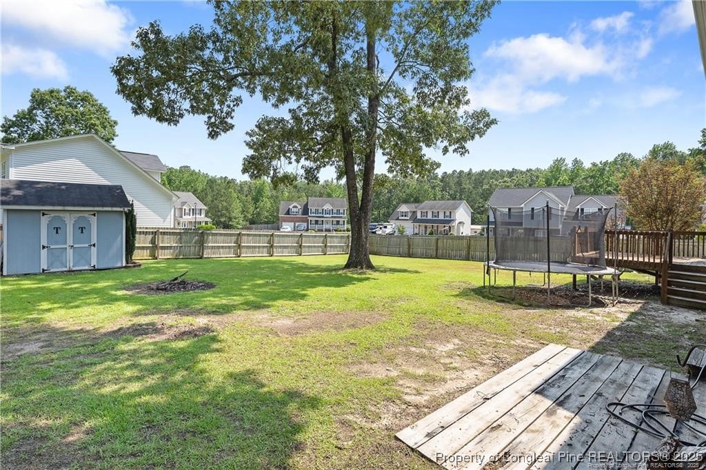 717 Lenoir Drive Spring Lake, NC 28390 - Photo 45 of 47 a view of a house with backyard and a tree