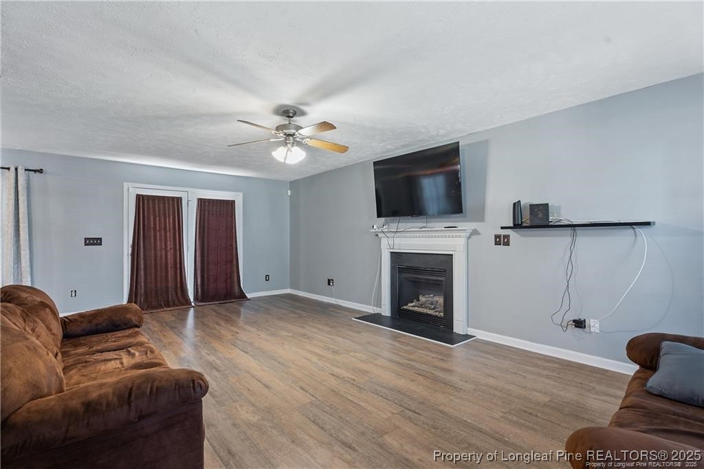 717 Lenoir Drive Spring Lake, NC 28390 - Photo 7 of 47 a living room with furniture and a fireplace