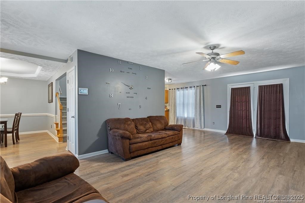 717 Lenoir Drive Spring Lake, NC 28390 - Photo 10 of 47 a living room with furniture and a chandelier