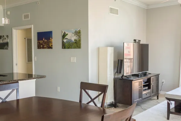 a view of a kitchen with fridge and workspace
