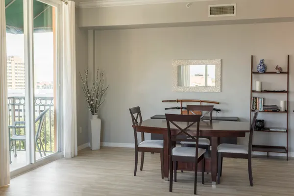 a view of a dining room with furniture and wooden floor