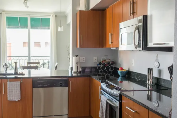 a kitchen with a sink and a stove top oven