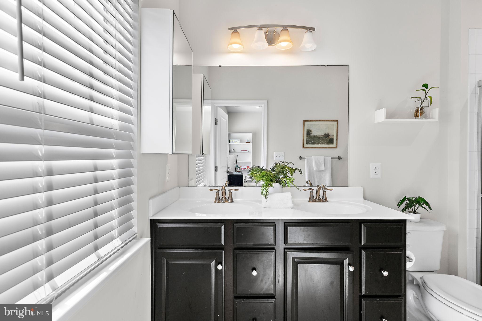1007 Rutland Avenue Baltimore, MD 21205 - Photo 11 of 27 Dual Vanity in Ensuite Bathroom