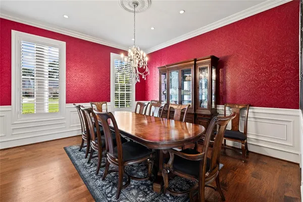 a kitchen with stainless steel appliances granite countertop a stove and cabinets