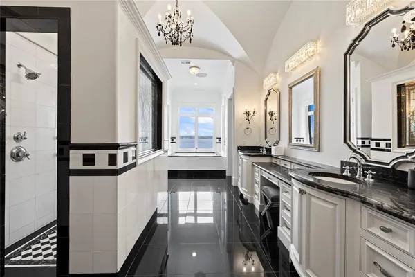 a white tub sitting next to a window