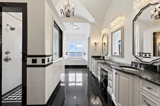 a white tub sitting next to a window