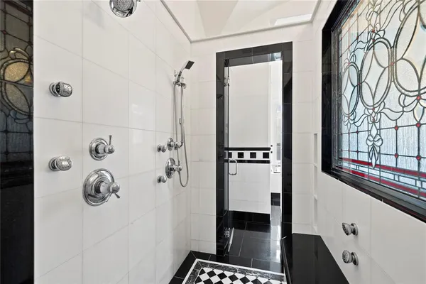 a kitchen with granite countertop white cabinets and stainless steel appliances