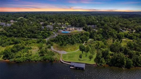 a view of a swimming pool with a yard