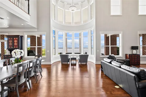 a living room with furniture and large windows