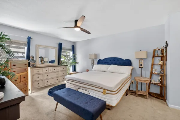 a bedroom with a bed and a dresser