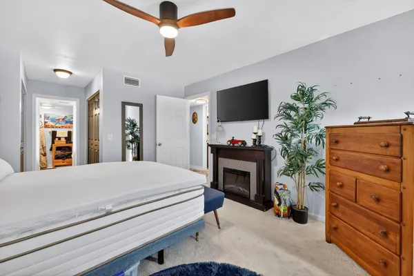 a bedroom with a bed and a television