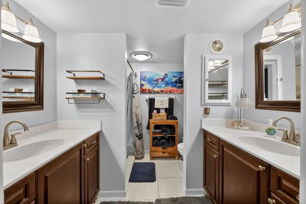 a bathroom with a sink double vanity and a shower