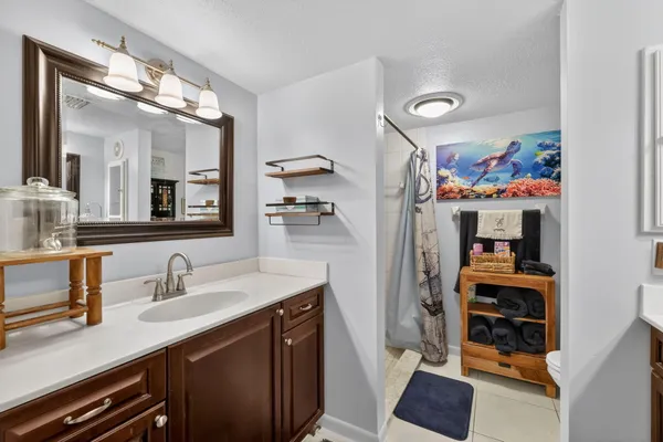 a bathroom with a sink double vanity and a mirror