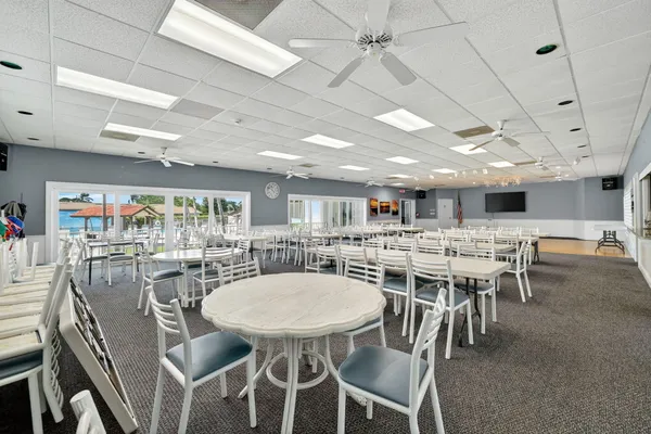 a room with furniture a air conditioner and a window