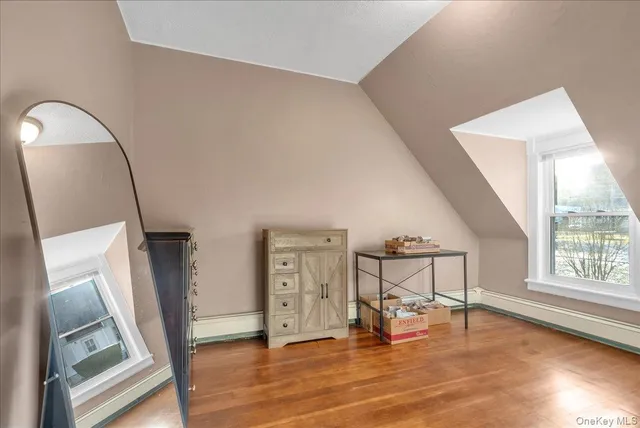 a view of an entryway with wooden floor