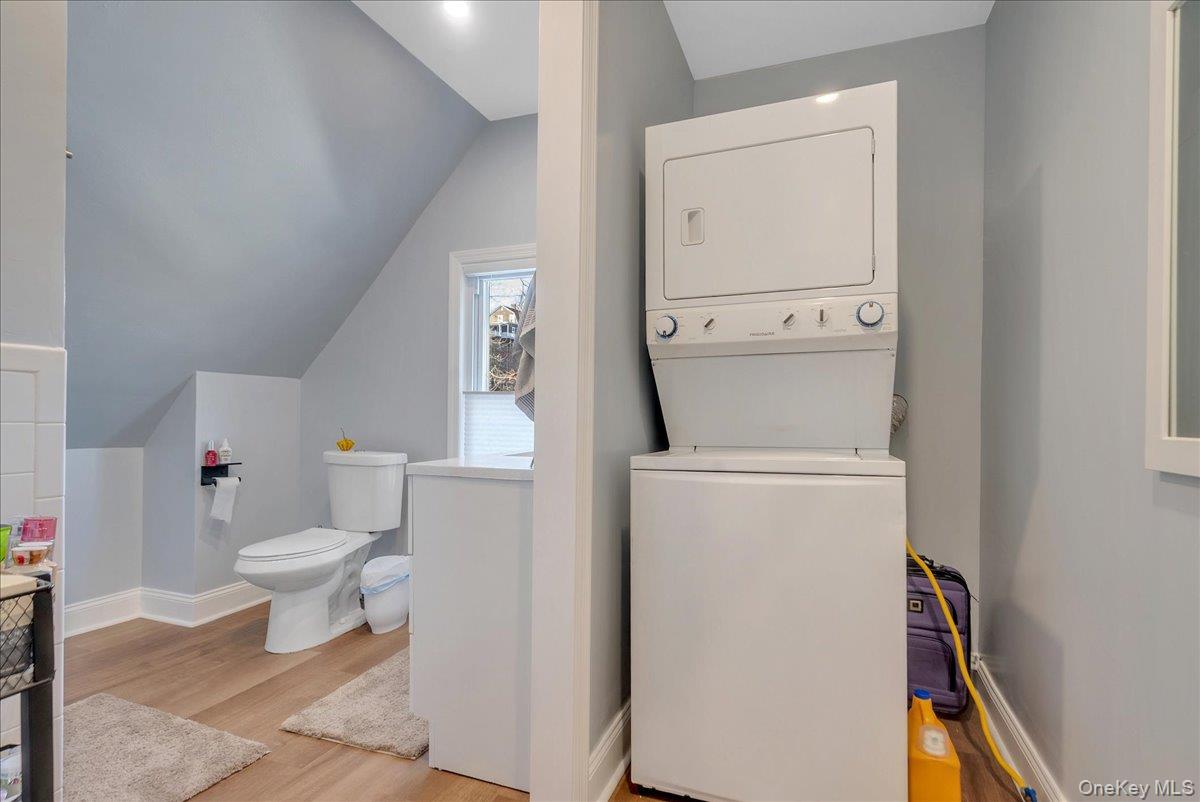 10 Spartan Place, Unit B Tuxedo Park, NY 10987 - Photo 17 of 27 a white toilet sitting next to a bathroom sink