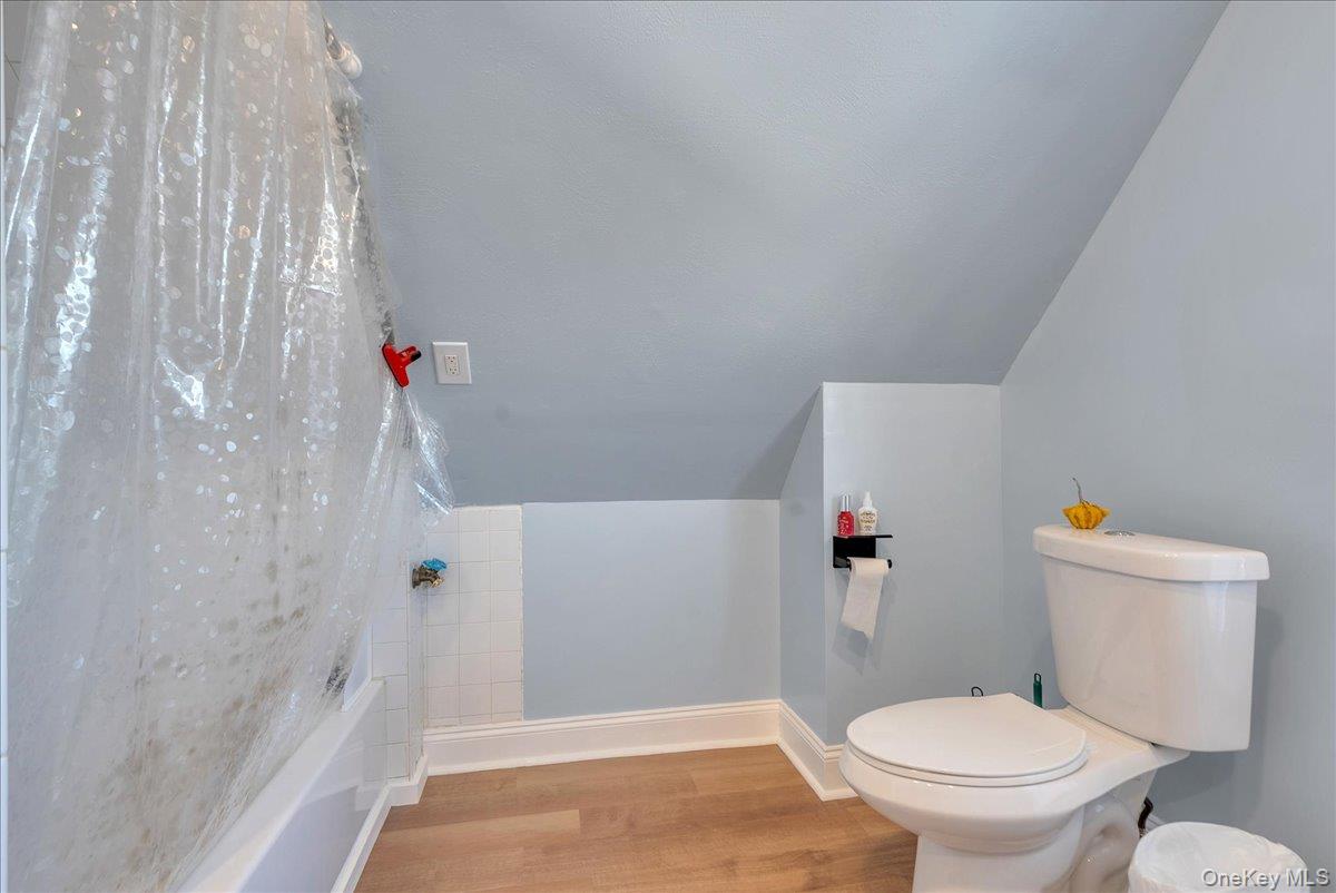 10 Spartan Place, Unit B Tuxedo Park, NY 10987 - Photo 18 of 27 a bathroom with a toilet and a shower