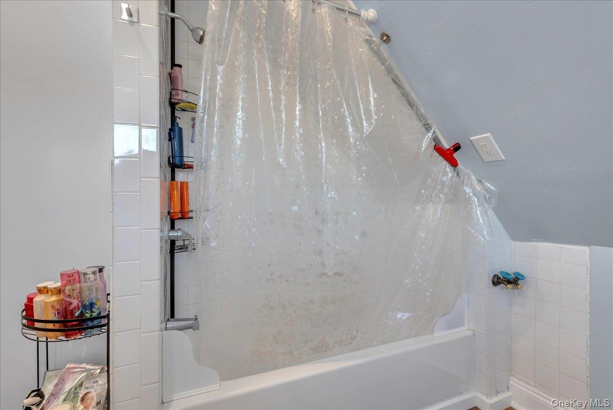 10 Spartan Place, Unit B Tuxedo Park, NY 10987 - Photo 19 of 27 a bathroom with a shower