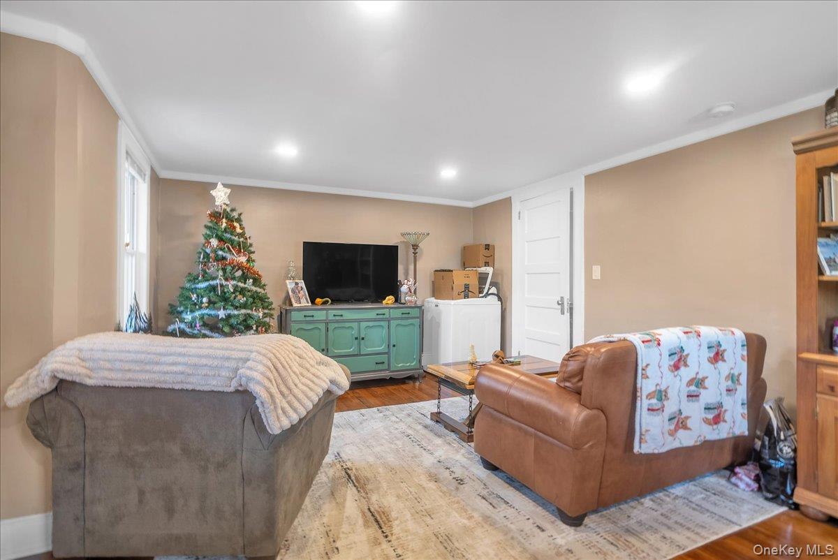 10 Spartan Place, Unit B Tuxedo Park, NY 10987 - Photo 4 of 27 a living room with furniture and a flat screen tv