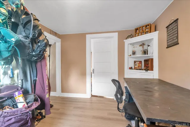 a view of a workspace with furniture and toys