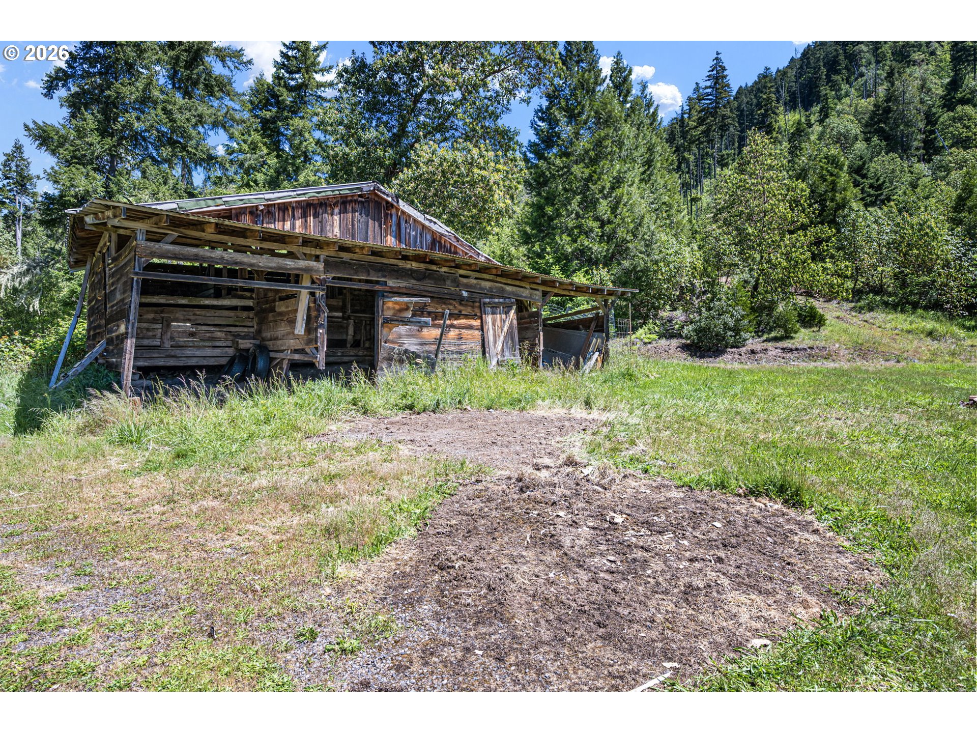 77521 Brock Road Oakridge, OR 97463 - Photo 41 of 48 a view of a house with a yard