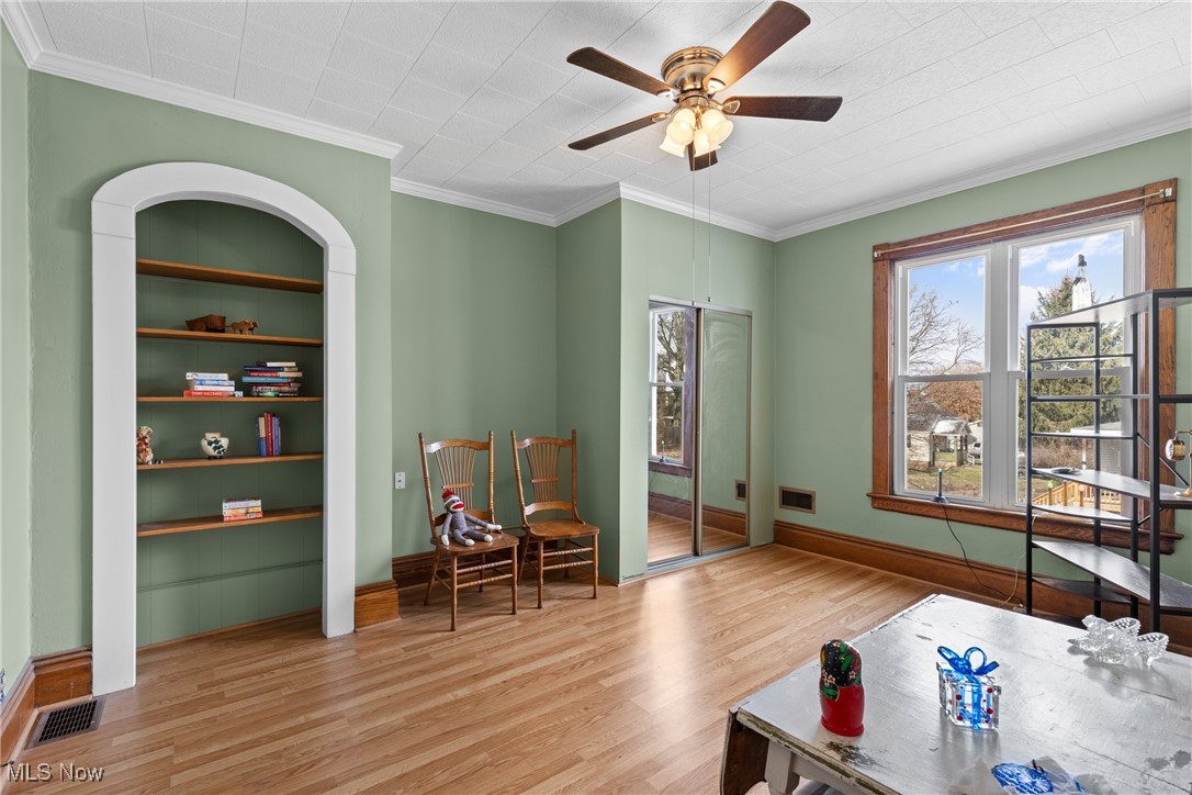 1011 Parriott Avenue Moundsville, WV 26041 - Photo 26 of 44 Sitting room with wood finished floors, a ceiling fan, and crown molding