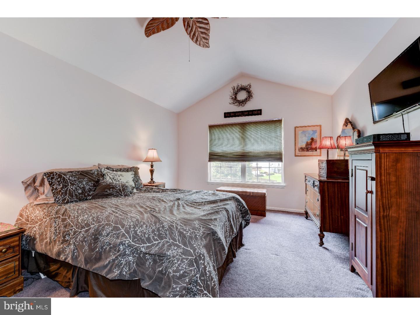 652 Melvin Road Telford, PA 18969 - Photo 15 of 25 a bedroom with a bed and a flat screen tv