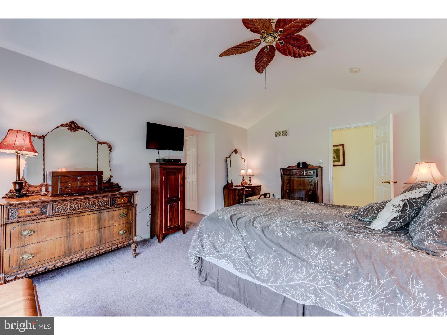 652 Melvin Road Telford, PA 18969 - Photo 16 of 25 a bedroom with a bed and a chandelier