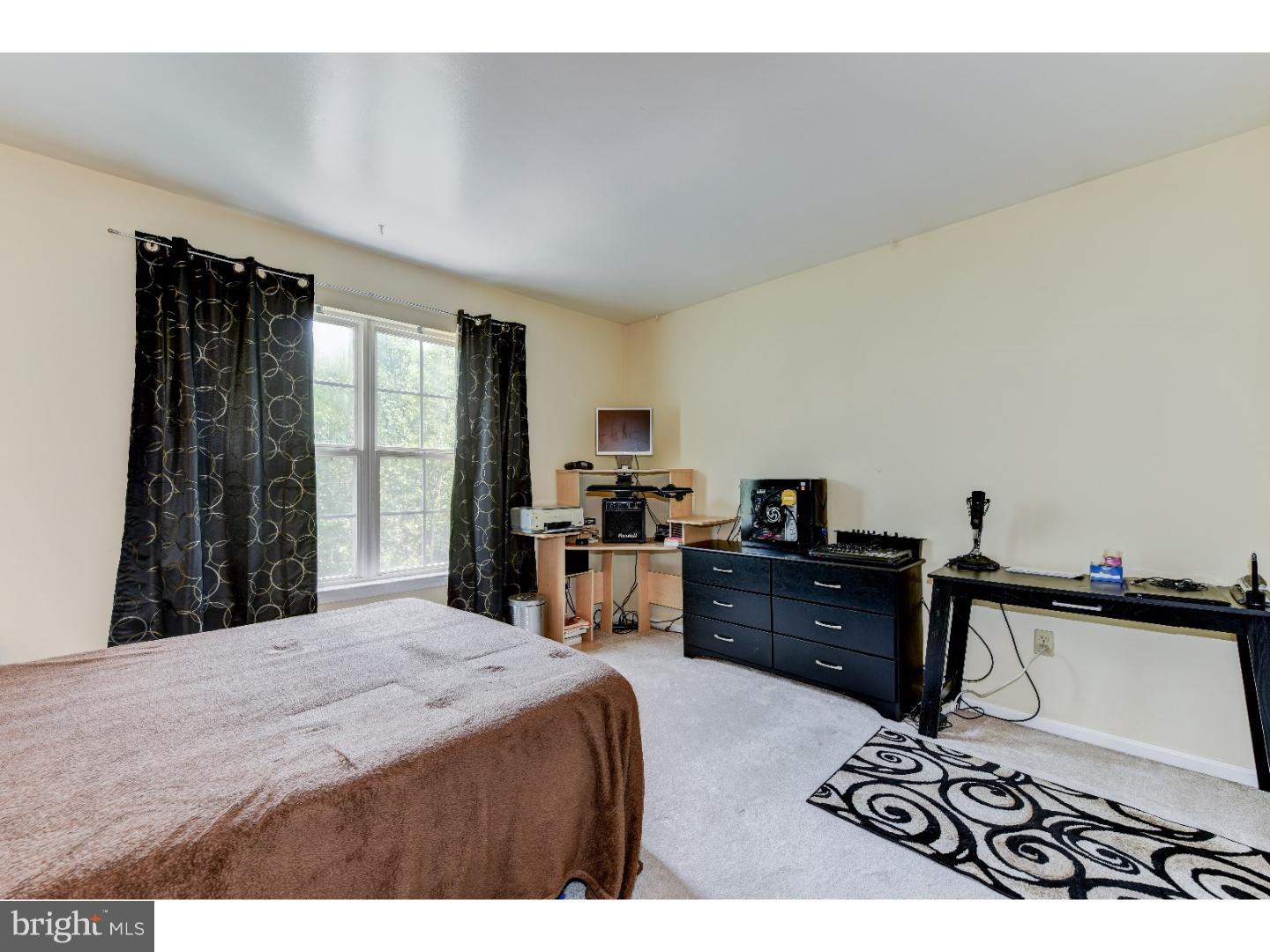 652 Melvin Road Telford, PA 18969 - Photo 17 of 25 a bed room with a bed and a television