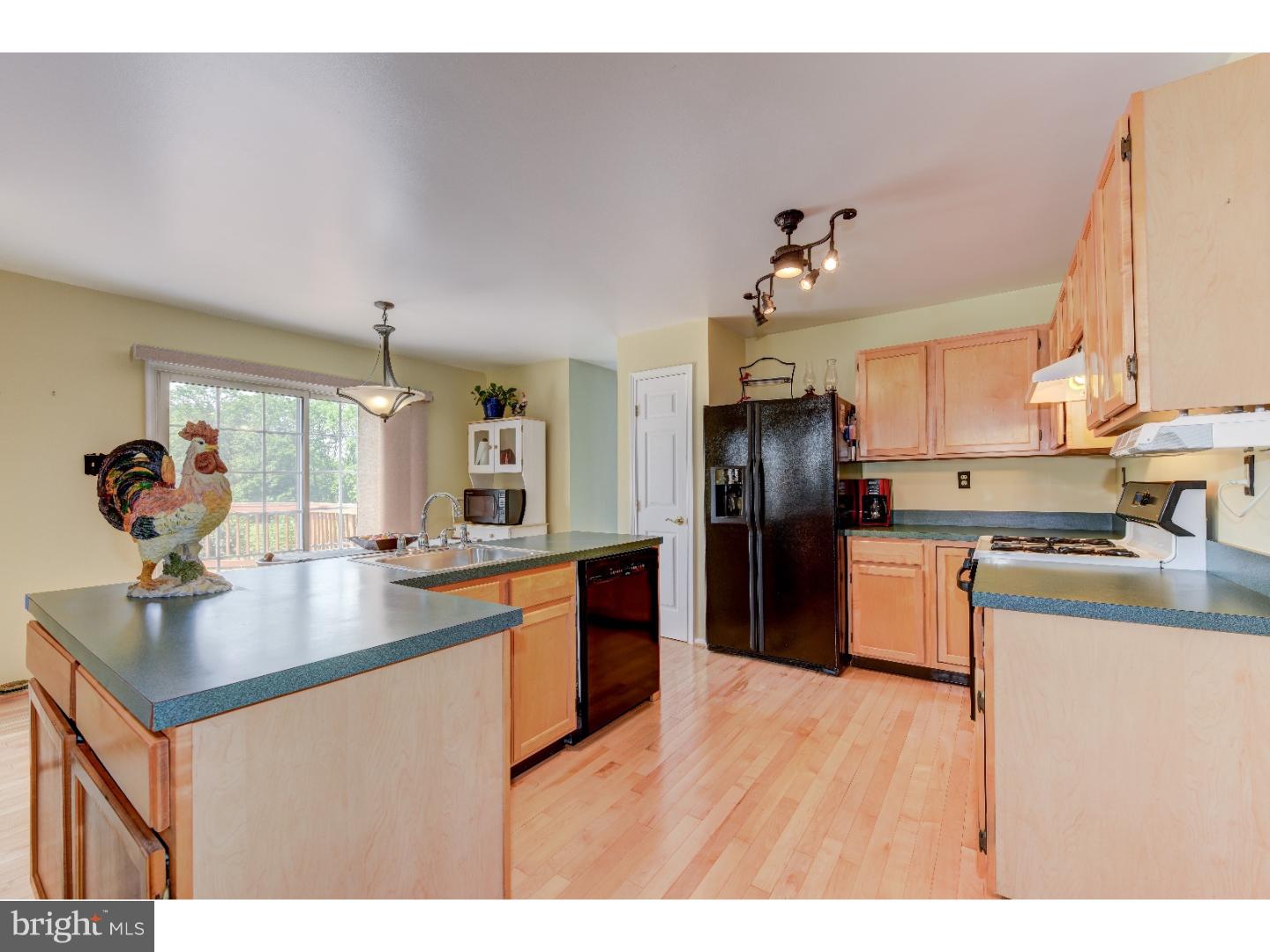 652 Melvin Road Telford, PA 18969 - Photo 2 of 25 a kitchen with granite countertop a sink cabinets and stainless steel appliances