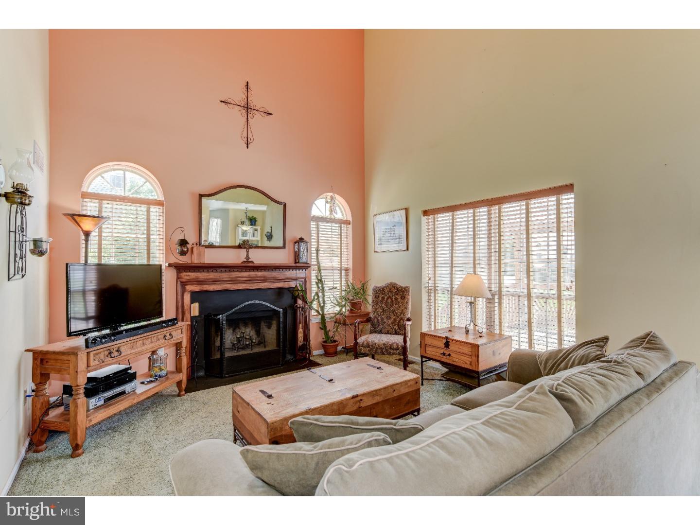 652 Melvin Road Telford, PA 18969 - Photo 7 of 25 a living room with furniture a fireplace and a flat screen tv