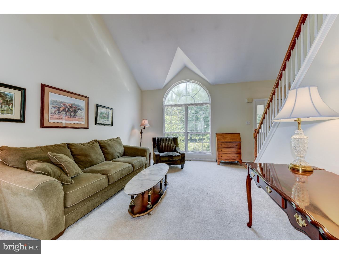 652 Melvin Road Telford, PA 18969 - Photo 10 of 25 a living room with furniture a fireplace and a large window