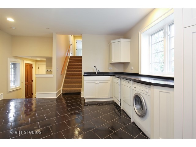 1203 Whitebridge Hill Road Winnetka, IL 60093 - Photo 13 of 24 a utility room with closet dryer and washer