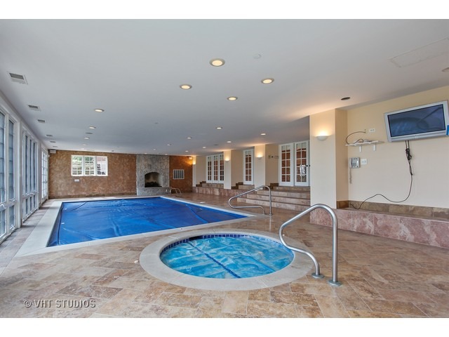 1203 Whitebridge Hill Road Winnetka, IL 60093 - Photo 16 of 24 a room with wooden floor pool table and windows
