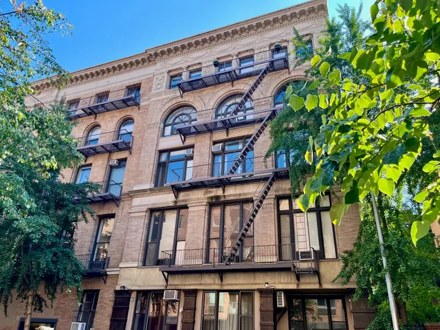 a couple of cars parked in front of a house