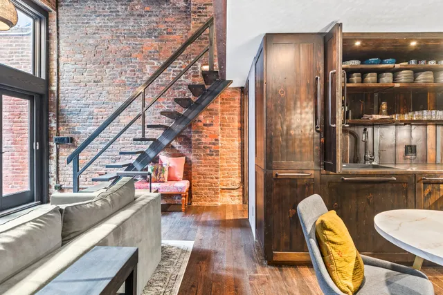 a view of living room with furniture and floor to ceiling window