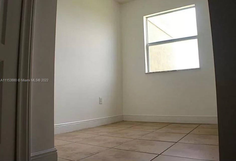 120 South Douglas Road, Unit 306 Miami, FL 33134 - Photo 13 of 17 a view of an empty room with a window